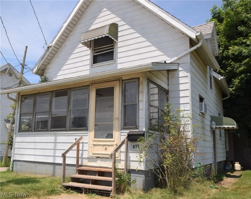 Welcome to 897 W. Wilbeth Road in Akron. This two bedroom, 1.5 bathroom home is a great investment opportunity. Spacious living room and dining room. Half bathroom conveniently located on first floor off the kitchen. Dining room has a gorgeous built-in around two large windows. Bedrooms and full bathroom located on second level. This home has a three-seasons front porch; a great spot to relax, rain or shine!