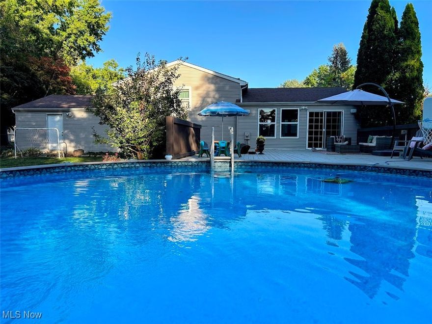 This is a one-of-a-kind home that you must see today!! Location, location, location! Only walking distance to a newly constructed Green Middle School, this retreat-like home will inspire you from the moment you walk in. Enjoy your summer breaks in a spacious, fully fenced, and wooded backyard. Close to 700 sq ft of light gray, spacious deck, surrounded by Tuscany-like pine trees, string lights, and a custom-designed stamped patio, this private oasis features an incredible setting by the pool. The interior of this gorgeous home resembles a beach house. The custom kitchen with island opens to the Dining Room and the Living Room, offering an open floor concept and inviting plenty of natural light. Lower-Level Family room features a whitewashed fireplace, above-grade windows, plush carpet, a Mud Room area with convenient access to a 2-car garage, and a full bathroom with custom glass shower, ceramic tile, and modern mirror and vanity. Upper-level features 3 bedrooms, 1 full bathroom, and a warm and cozy decor. Master bedroom overlooks the gorgeous pool setting. The landscaping in this bright home is immaculate. Enjoy your morning coffee on the cozy deck in front of the house and pick your apples from an apple tree. Backyard features a shed and a great space for some afternoon soccer practices. The kids' playset stays. The major new update is a brand-new energy-efficient furnace. The Listing Broker is related to the sellers.