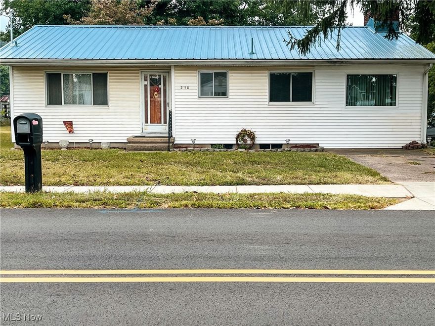 BELPRE RANCH HOME, offers 1,284 sf living space on the main level and 984 sf unfinished basement. Home has large ling room, open to kitchen and also has a large family room (30 x 10) with wood/gas burning fireplace and built in bookshelves. There are 3 bedrooms and a bath. The home offers an enclosed back porch with windows to view the spacious fenced-in backyard that has majestic large trees and flowering shrubs, offering a great place to relax. This yard offers a place to have a garden also, if you choose. The home has vinyl and aluminum siding and a newer metal roof, (approx. 4 years old), and some new windows and also bathroom upgrades. the electrical entrance has also been upgraded. There are original hardwood floors in the living room, bedrooms and hall. Windows are in good condition. Great location and close to amenities. Call today and come see this affordable, comfortable and well maintained home!