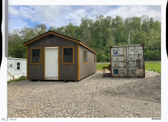 0.72 of an acre with 12x24 office with bath & kitchen hookups. 12x24 one car garage. Two 12x48 storage containers for housing, one 1 bdrm, 1 bath, stove, fridge, washer and dryer rents for $600 mo plus utilities. One 2 bdrm, 2 bath, washer, dryer, stove and fridge. bpth electric heat and c/a. Deck and storage unit in back for walk in closet. Two 8x20 shipping containers. All buildings and containers can be moved. Room for another big building, or more housing units. West of Zanesville. Close to Newark, Columbus. Road frontage on West Pike.