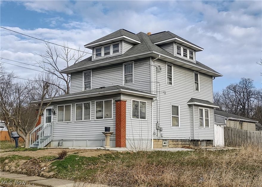 This large single-family home with 3-bedrooms (possibly 4), 2- full baths, and 2 kitchens has served as a 2-unit in the past.  It also features an attached 2-car garage, fenced back yard, enclosed front porch, fireplace, custom woodwork, and finished attic.  Being sold in as-is condition.
