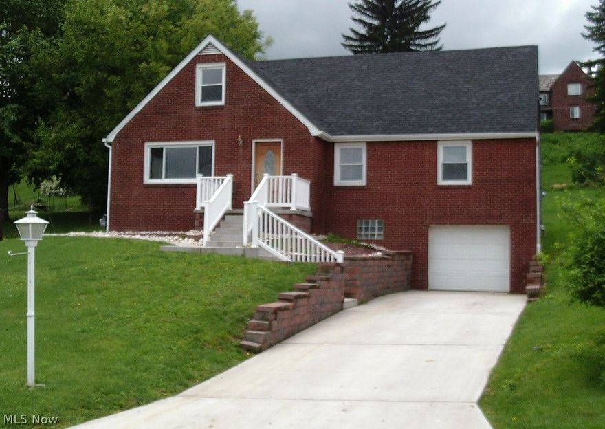 Total remodel as per the seller with newer roof, windows, furnace & a/c, HW tank, sewer line including main stack, electrical, plumbing, driveway, porch,retaining wall, carpet, bathrooms, flooring and paint.