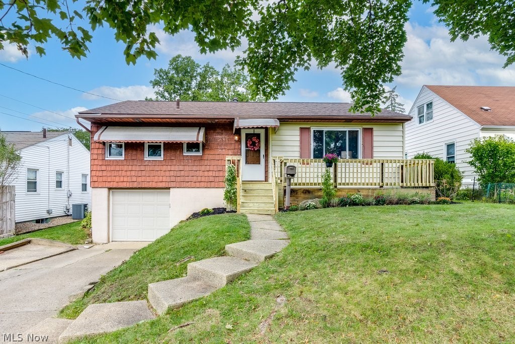 Delightfully remodeled 3BD/1BA Raised Ranch with several big-ticket improvements throughout! Enjoy an updated bath (2013), neutral paint, refurbished hardwood floors in the bright and airy living room, and newer carpeting. The eat-in kitchen with banquet area has been beautifully updated with custom cabinetry, Corian countertops, and stainless appliances (dishwasher 2022). A partially finished basement features an inviting family room, perfect for entertaining. The remodeled laundry area has newer vinyl flooring, washer/dryer (only 5 yrs old and included in sale!), and features a kitchenette area with a full sink and cabinets and can easily accommodate a full fridge or freezer. Extra storage is available in the unfinished utility room with newer H2O heater and humidifier (2016) and HVAC. The attached garage has a roomy and convenient entry that could double as a mudroom. Looking for a great outdoor living space? This home does not disappoint with its inviting deck overlooking the large