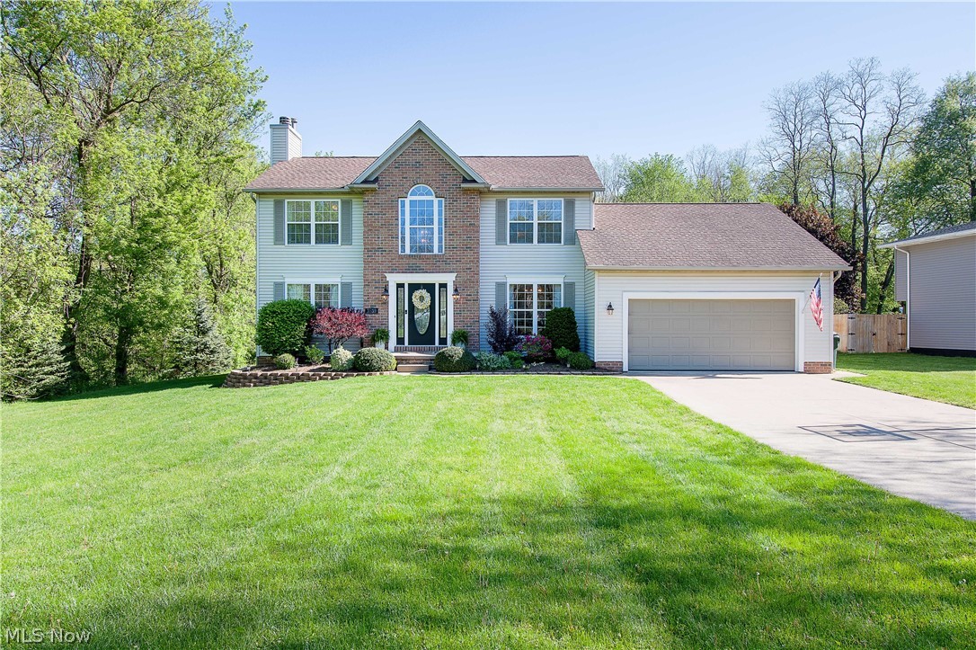 Welcome to this Fabulous home that sits on .82 acres of a beautiful private wooded lot. You will love everything this home has to offer, with many updates, bright, and very well maintained. Enter the foyer with a two-story ceiling with a beautiful chandelier & hardwood floor, and to the right is the formal dining room w large windows overlooking the front yard. The great room has a lovely brick surround gas fireplace. The bayed eat-in kitchen offers Quartz countertops, brand-new stainless-steel appliances (refrigerator will be installed soon), a breakfast bar, glass/tile backsplash, a pantry, and a dinette area. Upstairs you will find the master bedroom with a vaulted ceiling & a master bath with a walk-in shower, double sinks, and a walk-in closet (6x7); there are three other rooms and a full bath on this floor as well. Downstairs is a finished basement that features a rec room with a dry bar, recessed light, an office space area w built-in shelves, and lots of storage space. A convenient 1rst-floor laundry room with a countertop, a full bathroom, and a four-bedroom are a great part of the main floor. The backyard is large and private with a patio, a deck, and an above-ground pool (Heated, solar cover & newer liner 2019), great for relaxing & entertaining. Close to Green, N. Canton, Hartville, & the airport. This home is a must-see & will not last long on the market. Make this house your home!!