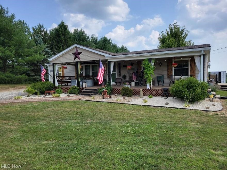 Wonderfully updated home in the country. Rustic updates throughout this 3 bed, 2 bath home will make your jaw drop. There is a lot to catch your eye from the new fixtures, butcher block counters, sliding barn doors and custom built in jetted tub. Newer stainless appliances and new electric fireplace. Large floor plan with huge closets for ample storage. Nice covered front deck is the perfect place to relax and enjoy the countryside. The property is surrounded by pine trees to increase privacy. Enjoy country living at its best with 3 acres of ground, a 2 story barn/stable(24x24) and the large outbuilding garage (32x40). The fence posts are up around the barn and can easily be used to fence in the back half of the property. Large garden area, and other various orchard trees. The outbuilding has cement floor, electric and 220 to hook up to a welder if needed. Its plumbed for a wood stove and the walls have been insulated. The lean-to on the side of the building works great as a carport or a chill area. This house, buildings and property have all been gone over and brought up to their best condition. Come check out this country beauty. You will not be disappointed.