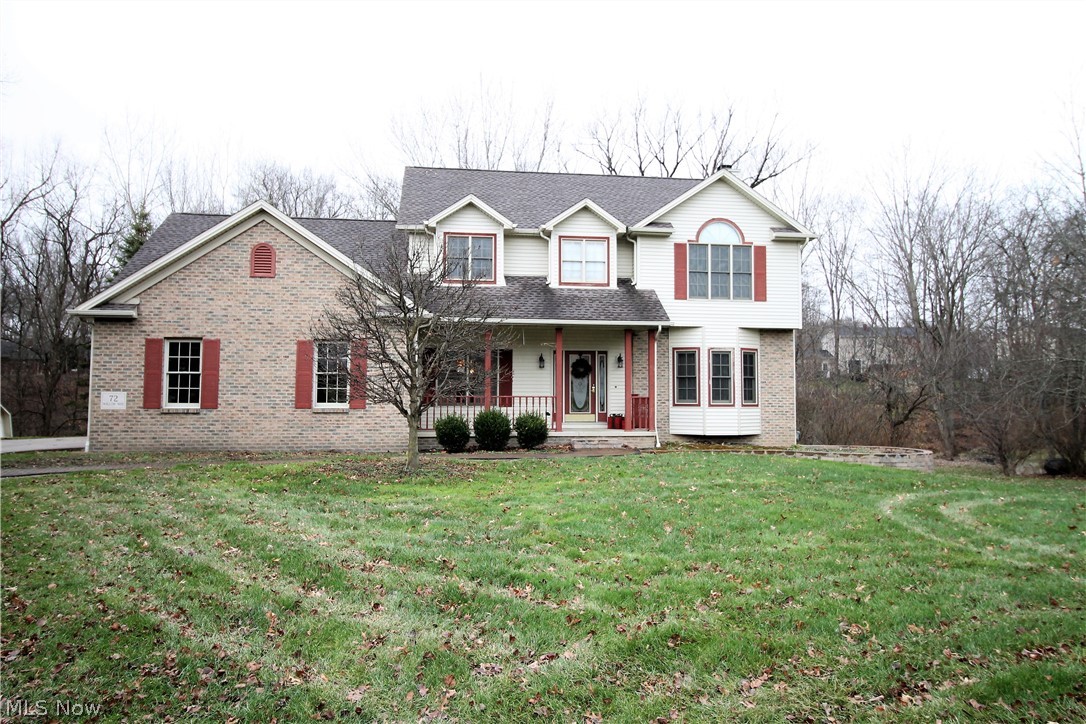 Welcome home to this stunning brick and vinyl colonial with covered porch. Tranquil wooded backyard with a babbling brook. Living room offering French doors and hardwood floors and opens to the beautiful family room with brick gas fireplace, ceiling fan, arched windows, hardwood floors. Formal dining room with tray ceiling. Wow! The updated, large bright gorgeous eat in kitchen offers ceramic tile floor, stainless steel appliances, farm sink, island, granite counters, under mounted lighting, and access to the large deck where you can sit out and enjoy the amazing backyard. First floor laundry with sink and half bath finished the main level. Upstairs you will find a huge master suite, large master bath with two vanities, garden tub, shower and a walk-in closet. There is a main bathroom and three more bedrooms. One could be a great rec room, office etc. The lower level offers a very clean, unfinished full walk out basement, storage space, could easily be finished. Shed. Attached three ca