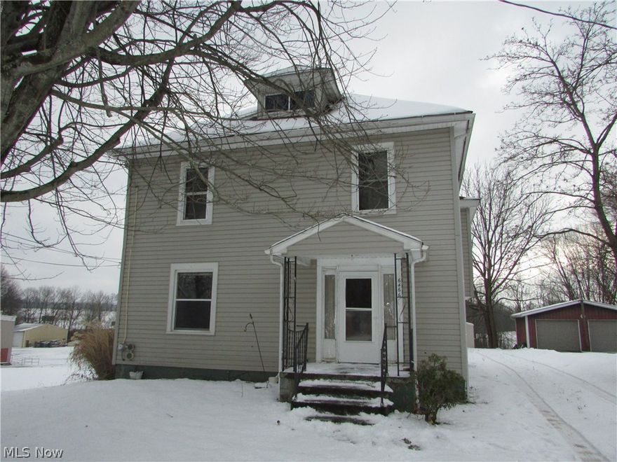 A large Atwater home with 4 bedrooms and 2 full baths.  A huge, heated, 2 car garage is to the rear.  This home needs work, but is an excellent investment.  Some updates have been made.