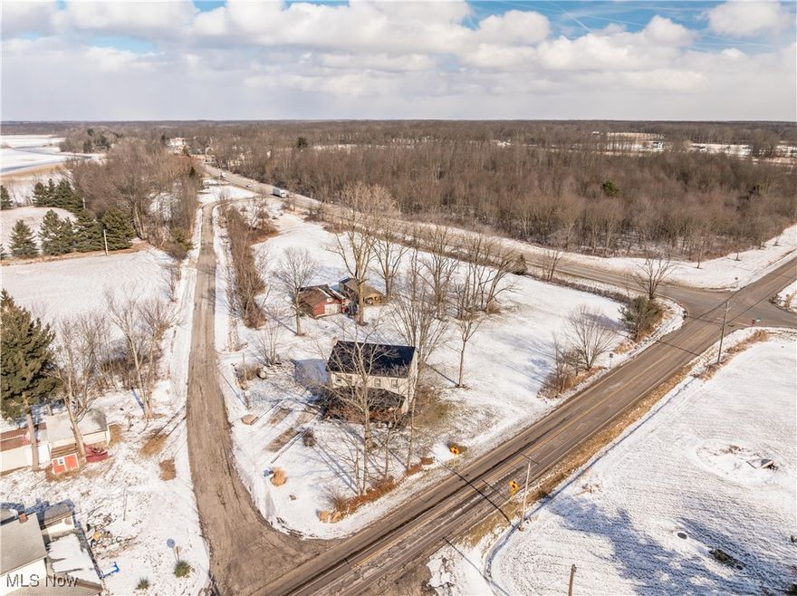 Welcome to this charming farmhouse built in 1850 and lovingly family owned for the last 40 years, perfectly situated on 4.67 acres at the corner of Lexington Road. This property offers a rare blend of character, space, and flexibility, featuring a three-bedroom, two full bathroom main home plus an additional secondary living space on the property.
Step through the front door into a welcoming living room highlighted by a beautiful original brick fireplace with a wood beam mantel. The layout flows in a functional circular design, leading into a second family room ideal for additional living or entertaining space. The kitchen offers an open concept feel into the dining area and features custom-built cabinetry, first-floor laundry, and a full bathroom conveniently located just off the kitchen. Upstairs you will find three nicely sized bedrooms, a second full bathroom, and access to a walk-up attic for additional storage or future potential.
The main home has seen many important updates, including a concrete sidewalk in 2023, front porch in 2023, electric panel in 2024, roof in 2021, granite countertops in 2020, new well pump, hot water tank, pressure tank, and water softener in 2022, a new back porch in 2022, updated carpet upstairs in 2022, first-floor carpet in 2024, and a furnace installed in 2015.
Adding even more value, the back of the property includes a unique secondary living space that appears to be a shed from the outside but offers a functional interior with a living room open to the kitchen, an additional living area, a bathroom, and a bedroom, with the back porch recently converted to create the bedroom. This space has its own electric box and includes a composite toilet. A detached garage and additional shed provide even more storage and utility.
This is a truly special opportunity offering acreage, charm, and multiple living spaces in one property. Come take a look and experience everything this rare listing has to offer.