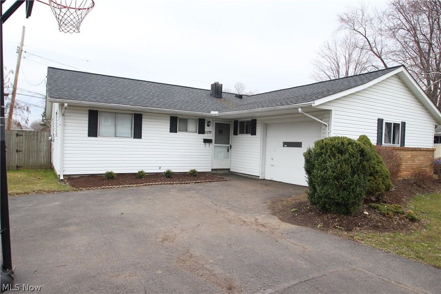 Welcome home to a charming ranch in Mentor! You will be pleasantly surprised with how open the home is.  The eat-in kitchen has newer cabinets and ceramic floor, all appliances stay.  The entire house has newer carpet that is a nice neutral color, perfect to go with any décor. Off the kitchen you will find a large mudroom/laundry with both garage and backyard access.  There is also ample storage with the pull down attic access in the mudroom. Enjoy time around the wood burning fireplace in the family room.  You can access the patio and backyard through the family room sliding glass door.  Down the hall you will find a refreshed bathroom and three nicely sized bedrooms with plenty of closet space.  The hot water tank was replaced in 2011, furnace in 2012 and roof in 2014. Warranty included.