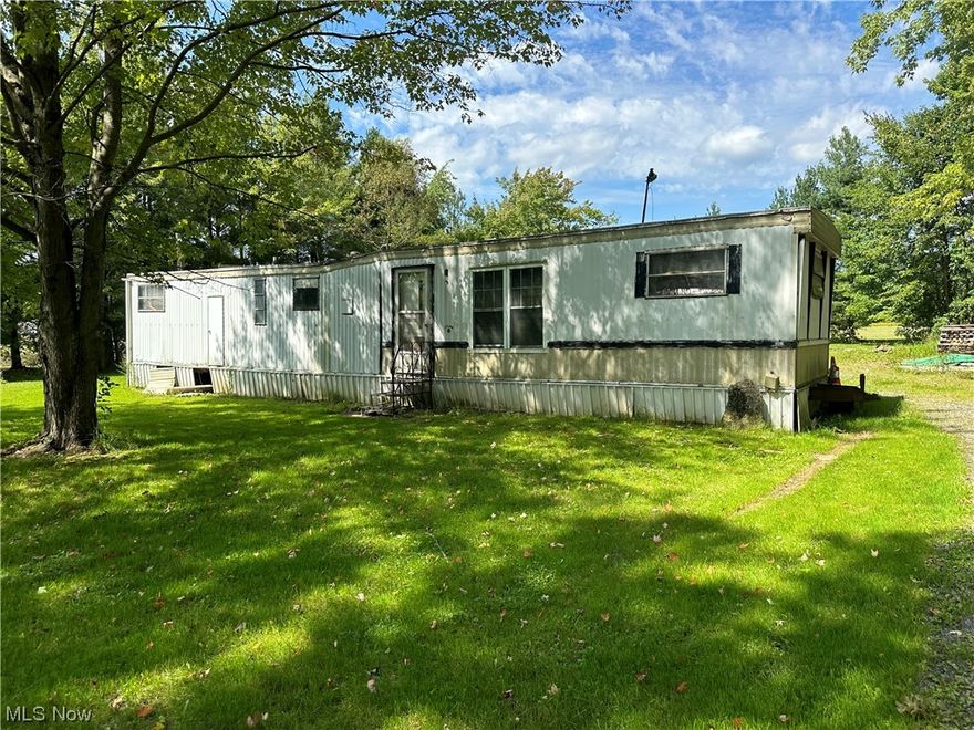 Perfect location to call home. Approximately quarter acre with detached 2 car garage that has heated floors, electric and a new hot water tank. Trailer is inhabitable and no access will be provided. Property is being sold in "As Is" "Where is" condition. Well and septic are on the property. It is buyers responsibility to conduct due diligence of property condition and verify ALL information regarding property including but not limited to amenities, utilities, condition, taxes, zoning use or violations, assessments, special assessments and or lot size. Seller will make no repairs, warranties or guarantees.