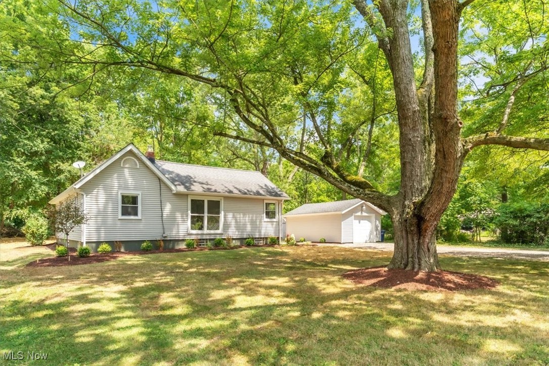 Don’t miss this charming 3-bedroom, 1-bath ranch nestled on 1.5 private acres in Tallmadge. This home offers a cozy layout, a bright living area, and a compact kitchen with everything you need. The exterior has great curb appeal, fresh landscaping, and a detached 1-car garage with a long gravel drive. The expansive yard is perfect for outdoor living, gardening, or future additions. Located in Tallmadge School District, this is a rare opportunity to own a move-in-ready home with land in a desirable and convenient location.