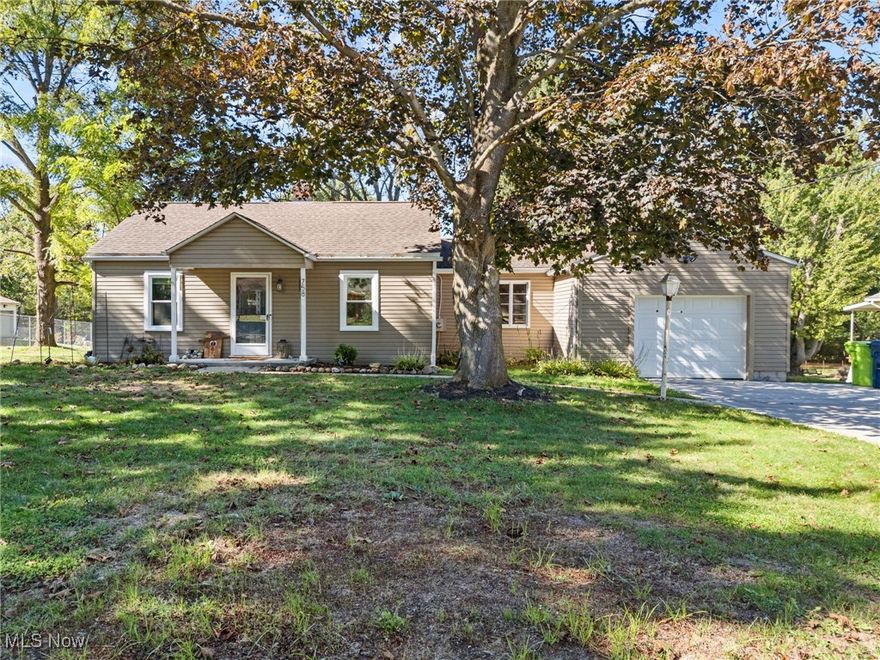 Welcome to 758 Humble Road! This updated ranch in Tallmadge offers three bedrooms and one full bathroom on nearly three-quarters of an acre of land. Enter through the front door to a bright and spacious dining room featuring fresh paint and updated flooring. To your left, you'll find two comfortable bedrooms and the full bathroom. The heart of the home is the completely remodeled kitchen, showcasing quartz countertops, soft-close cabinetry, a 60/40 sink, and stainless steel appliances. Just beyond, the large living room provides the perfect place to relax or entertain, with new sliding glass doors leading to a charming screened-in porch overlooking the expansive backyard. The roomy primary bedroom is conveniently located off the living room, offering privacy and comfort. The attached garage and basement are also accessible from this space, adding functionality and storage options. Out back, you'll love the generous yard - perfect for gatherings, play, or future outdoor projects - complete with a basketball area for a little friendly competition. Recent updates include: triple-pane windows (all but two - 2025), sliding glass door (2025), recessed lighting (2024), double driveway (2024), garage door and opener (2024), fully remodeled kitchen, including appliances (2023), tankless water heater (2023), furnace & A/C (2023), LVP flooring in dining room and kitchen (2022), carpet and padding in living room and primary bedroom (2022), sewer line fully replaced with new cleanout (2021), some updated plumbing and electrical (2019-2025), and more!