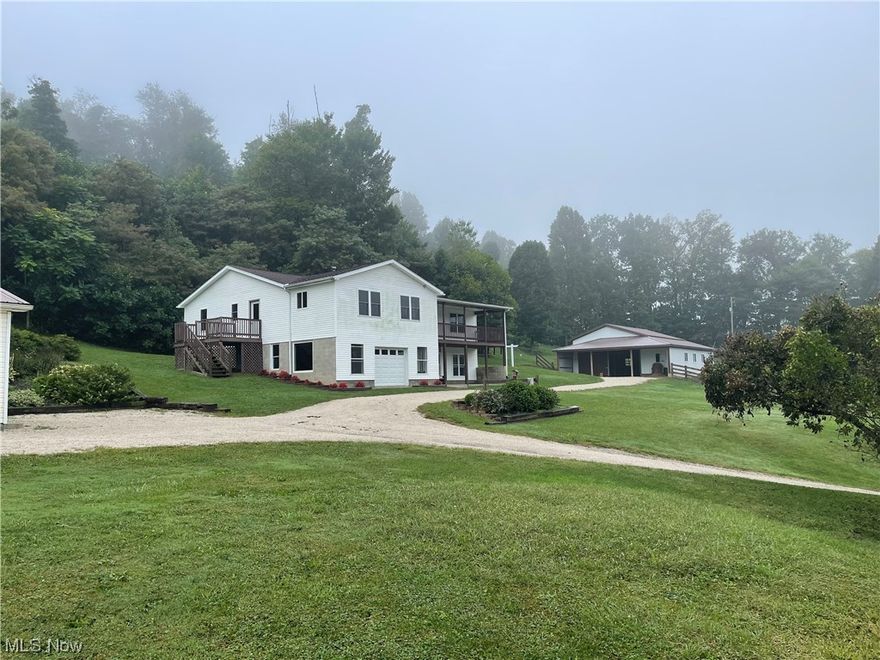 Welcome to your dream equine or small animal farm in the scenic countryside of Carrollton, Ohio! This stunning property sits on a spacious 3.55 acres and offers both convenience and tranquility. Built in 2010, this beautiful home features four bedrooms and two bathrooms, providing ample space for you and your loved ones. The open floor plan and abundant natural light create a warm and inviting atmosphere throughout. The basement, boasting an impressive 13-block high construction, surprises with several large windows that flood the space with sunlight, making it feel not quite like a basement at all. Equipped with a custom-built barn in 2013, this property is perfect for housing your livestock, boasting 4 stalls, tack room, and overhead storage. Additionally, a two-car detached garage offers convenience and additional storage options. The charm of this property extends beyond the living areas, as approximately half of the land is beautifully wooded. Take a leisurely stroll through, pick some berries, or simply sit back and observe the local wildlife. Located just minutes away from downtown Carrollton, this property perfectly combines privacy and convenience. Enjoy the peacefulness of the countryside while still being within easy reach of local amenities, shops, schools, and restaurants. Don't miss the chance to own this beautiful property! Embrace the tranquil lifestyle this property offers and create memories that will last a lifetime. CALL TODAY!