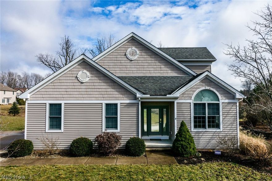 Amazing opportunity to own a newer modern home in Hudson!  This former model home is one of a kind and is conveniently located in Stonecreek Reserve, minutes from downtown Hudson and Kent!  The expanded Cape Cod design offers a modern open floor plan, soaring ceilings, and even a hard to find first floor master suite! The main floor consists of a 2-story great room w/hardwood flooring and gas fireplace, huge built in book shelves and slider to a spacious deck overlooking the pond. The gourmet kitchen is appointed with maple cabinetry, island, stainless appliances (all included, as well as a trash compactor!), large pantry & granite overlay countertops, and a breakfast area/dinette.  The private 1st floor master suite has a tray ceiling, 2 closets + a walk-in closet, glamour bath w/jacuzzi tub, double sinks and shower w/tile flooring. The formal dining room is showcased with pillars & skylights for tons of natural light! Main level is competed with a dedicated office w/hardwood flooring