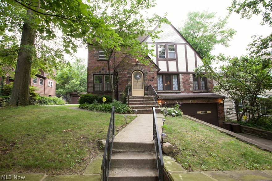 You will love the charm that this home offers throughout. Gorgeous HWFL & Natural woodwork. Exceptional stone fireplace & very inviting. 4 season sun room/office off Formal Living Room. This home offers a nice eat-in kitchen & formal dining room. Don't miss the large 3rd floor suite complete w/ 1/2 bath, skylight & vaulted ceiling! Convenient attached 2 car garage & private rear patio complete this wonderful Tudor home.