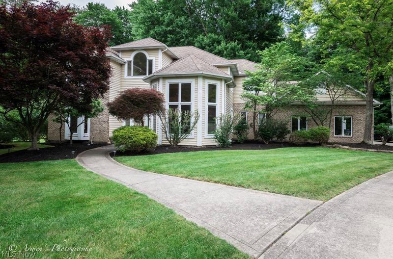 A lovely home situated on the most beautiful three acre wooded lot in Solon. 4 large bedrooms with 4 and 1/2 bathrooms. The grand two story foyer welcomes you into the formal living room with a soaring ceiling. The adjacent formal dining room boasts a sparkling crystal chandelier. Lots of updates: new furnaces & AC units in 2018, new flooring on most of the first floor. Family room features a marble fireplace and access to the large rear deck. The first floor library/study can also function as the 5th bedroom with the adjacent full bath and closet. The master suite features a large and elegant bath, his and hers walk-in closets and jetted tub. The upstairs study/bedroom is connected to the master featuring a wall of built-in shelving and cabinetry. The guest room has a private bath. Enjoy the lush landscaping and beautiful views in the deep backyard. A perfect house to live in!