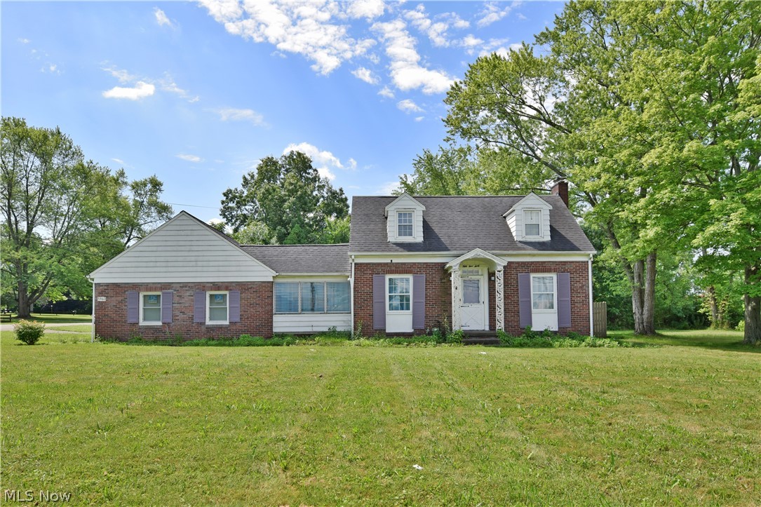 Sunshine fills this beautiful home, set just minutes away from prime shopping and restaurant districts! The recently updated residence offers a handsome, brick exterior paired with a massive corner lot that isn’t one to miss. A blacktop drive leads to an attached, rear facing two car garage while a nearby patio looks on. An illustrious breezeway bridges the home and the garage as French doors open into a cozy dining room. Sculpted plaster archways beckon into the adjacent foyer, passing by the main staircase as you enter the living room. Hardwood flooring runs beneath as it continues throughout the home. A stylish fireplace sits center while sconce lighting adds an elegant touch. The brightly lit kitchen awaits opposite with tiled flooring and wrapping wood cabinets. A half bath joins a small pantry along with basement access. Upstairs, a pair of inviting bedrooms offer chiseled features as sloping ceilings shape the rooms. A full second floor bath completes the package with a simple v