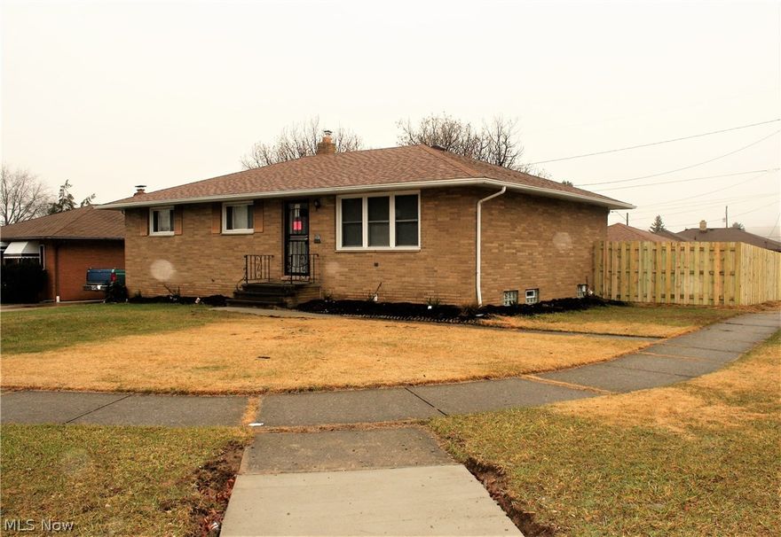 Professionally renovated brick ranch. The Eat-In Kitchen has new stainless steel stove, range hood and dishwasher, ceramic tile floor, walls and backsplashes, new countertops and plenty of cabinet space. The living room , dining room and hallway have beautiful hardwood floors newly refinished. Dining room has a sliding door to the backyard custom stamped and slate dyed concrete patio. The hall and all bedrooms are newly carpeted and spacious. Both the master and the front bedrooms have dual closets The master bedroom has its own access to the completely remodeled first floor half bath. Both first floor baths have  been completely remodeled with custom ceramic floor, walls and tub surround, new vanities, light fixtures and accessories. The entire house has new windows and glass block windows in the basement. One half of the basement is a 600+ square foot family room with new carpeting, glass block windows and lighting. The other half of the basement contains the laundry area (which is s