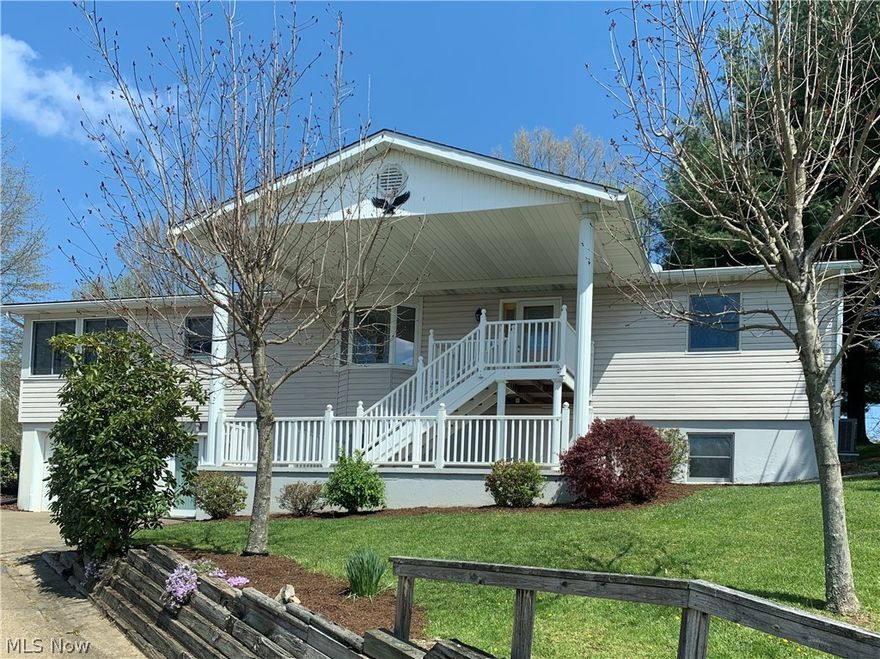 First floor living.  First time on the market.  Three bedrooms with great closet space.  Bath on main floor with newer walk in shower and linen closet.  First floor laundry.  Living room with beautiful bay window.  Kitchen with bar and open to the dining area with built in hutch and large pantry.  Large bonus room with three walls of windows to an amazing view.  Full walk out basement with carpet, full bath, storage rooms and access to attached garage.  Two car detached garage with gas, electric, water and an attic.  Covered back porch leads to a flat backyard with storage building.