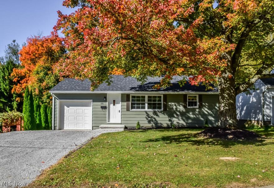 Beautifully remodeled 3 bedroom ranch with a walkout lower level! New roof, windows, A/C, flooring, kitchen, bathroom, finished lower level and more! Prepare your favorite dishes in the brand new kitchen with white cabinets, stainless steel appliances and direct access to the back deck - convenient for grilling. Gather in the spacious formal living room with large windows. Down the hall, there are 2 bedrooms and a gorgeous full bath with tile shower surround and an updated vanity. Hallway built-ins for linens. Third bedroom on the finished, walkout lower level plus a huge rec room! Walks out to a peaceful, tree-lined backyard. 1-car attached garage plus an extra wide driveway. Great location minutes from the school, recreation center and Bauman Orchards! A must-see!