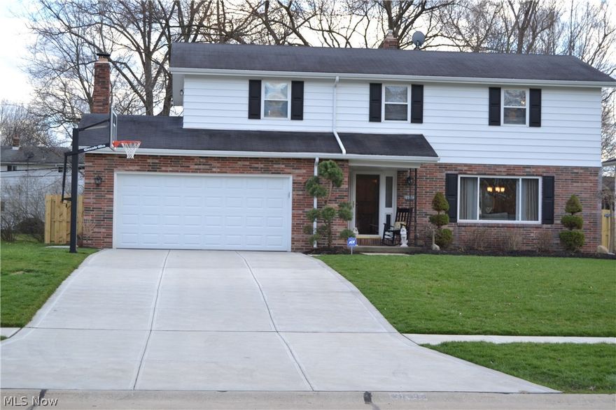 A great Colonial with many new updates, starting with the kitchen, is located within one mile of shopping and entertainment to Great Northern Mall. The kitchen granite counter tops flow throughout an opened dining room and cover the new wood cabinets. New appliances and fixture have also been updated as well. The larger front living room makes this a great area for watching TV or entertaining guests leading directly into the dining room and open kitchen. For those chilly winter nights enjoy a wood burning fireplace in the family room with adjacent bathroom for convenience. Proceeding upstairs the hardwood floors carry you into three of the bedrooms for a continuous flow. The fourth carpeted master bedroom boasts its own bathroom with a walk-out patio, chair rail molding, and a large enough space for all your furniture. Updated windows are also found throughout the house and over sized driveway poured within the past 2 years. For those nice summer months a screened in porch can be found