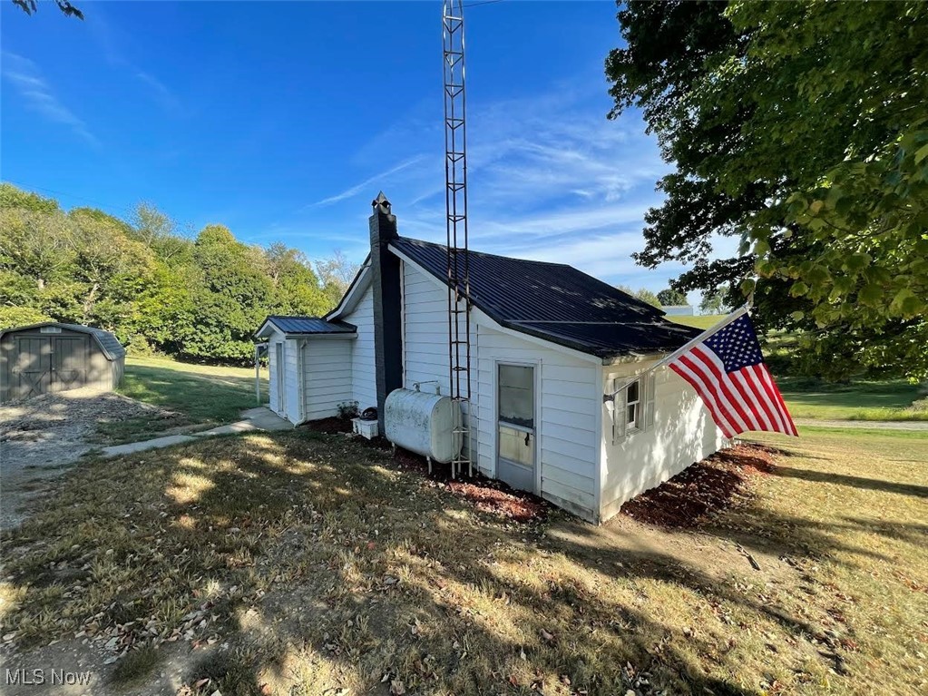 You will love sitting on the back patio enjoying all nature has to offer with wooded country views. This home sits on 3 lots, that total 1.5 acres. This pretty bungalow offers original historic charm in a quite setting. Consider exploring the potential of building or adding another home, single or double wide on one of the parcels for an added investment opportunity. This home is adorable and "cute as a button"! The entire first floor has been freshly painted with brand new flooring (2024) throughout the entire first floor! Vinyl plank floor in kitchen and bathroom, new carpet in bedrooms and living room. The kitchen is fully equipment with a
stove and new stainless-steel refrigerator. Newer Metal Roof was installed about 8 years ago. Window A/C unit new in 2024. The entire basement is Super Clean, walls have new mortar and freshly painted white. A garden shed for added storage is included!
This home has been a great rental for the owner the past 4 years. He decided to Rehab the home making it Move in Ready for the future new homeowner. Don't miss this fantastic opportunity for home ownership at an unbelievable price! Septic has been Repaired.