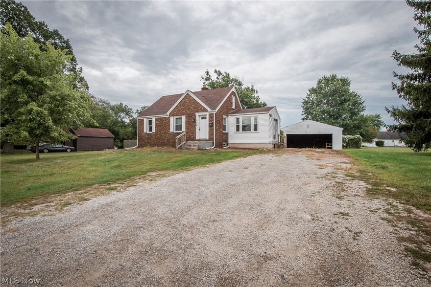 AFFORDABLE CANTON LOCAL SCHOOLS BUNGALOW! This 3 bedroom home would make a great investment property for your portfolio! The cozy living room with hardwood floors serves as the heart of the home centrally located to the kitchen, bedrooms, as well as the full bath. The kitchen offers newer countertops and appliances, a large breakfast bar, great cabinet space and open view to the spacious dining room with sliding door access to the backyard. Down the hall, you will find two of the three bedrooms, each with easy access to the full bath with newer walk-in shower. Upstairs is the third bedroom which would make a nice private master bedroom or office space for those who work from home. Head outside where you will find a detached 2 car garage and almost half an acre of land that's fenced in for your kids and pets to play. Other updates include windows 2014, roof & hot water tank 2013. Seller is motivated so schedule your showing today!