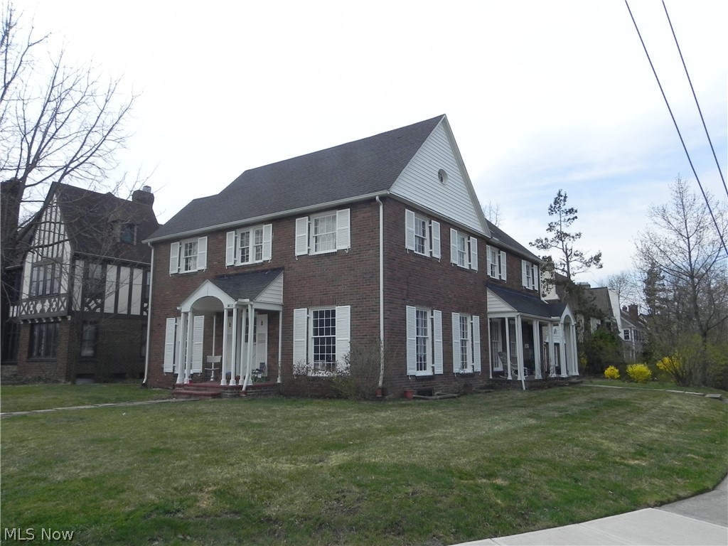 Opportunity is knocking! A true side-by-side duplex, located on the corner of Historic Winslow & Lynnfield just blocks away from the popular hotspot Van Aken District! This brick center hall Colonial provides separate entrances, separate basements and a 4 car garage, the perfect set-up for an owner occupant! The Winslow Rd side (currently owner occ) offers Kit, Din Rm, Family Rm w/ fireplace on 1st floor, 3 bedrms 1 bath on the 2nd floor & 2 bedrms 1 bath on the 3rd floor. The Lynnfield Rd side offers Kit, Din Rm, Family Rm w/ fireplace on 1st, 3 bedrms 1 bath on the 2nd floor & 1 bedrm 1 bath on the 3rd floor. This Shaker Hts charmer is full of many architectural details, large windows and hard wood floors throughout. Great investment. A block away from Rapid Transit line, easy access to highways and much more!