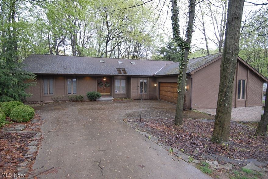 Ranch home in cul-de-sac on wooded lot it has 3 bedrooms and 3 1/2 baths.  Living room, den, hall, and 3 bedrooms all have new carpet. Master bedroom has 2 closets, bathroom, and skylight. Formal living/dining room with fireplace and den on first floor.  Eat in kitchen with pantry, and two skylights. Laundry is on first floor. Foyer and den also have skylights.  Large finished basement good for entertaining with pool table, bar, and wet bar with refrigerator. Fireplace in family room.  Lots of storage  in basement. Wood trimmed atrium doors lead to deck which has 3 levels and there is a  patio area off family room. Attached garage has space for two cars.