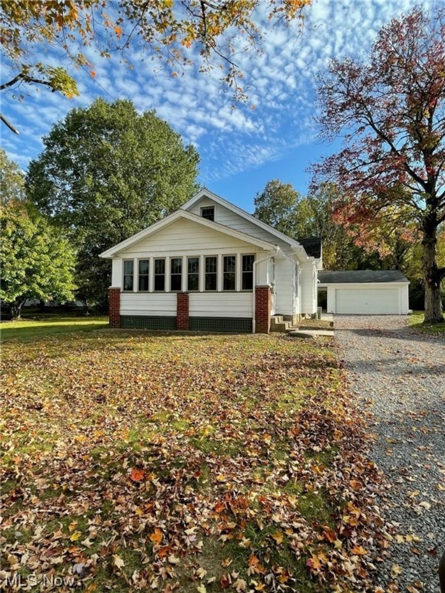 Charming home situated on 1.5 acres features 3 bedrooms, remodeled kitchen & bathroom, formal dining room & living room, enclosed porch and an over-sized 2 car garage. Updates include; newer roof, furnace, central air, vinyl windows, cement patio & 100 AMP breaker box. Kitchen, bathroom, flooring & cement patio done in 2023. Glass block windows in basement. Auditor's square footage is INCORRECT. Can be shown on short notice.