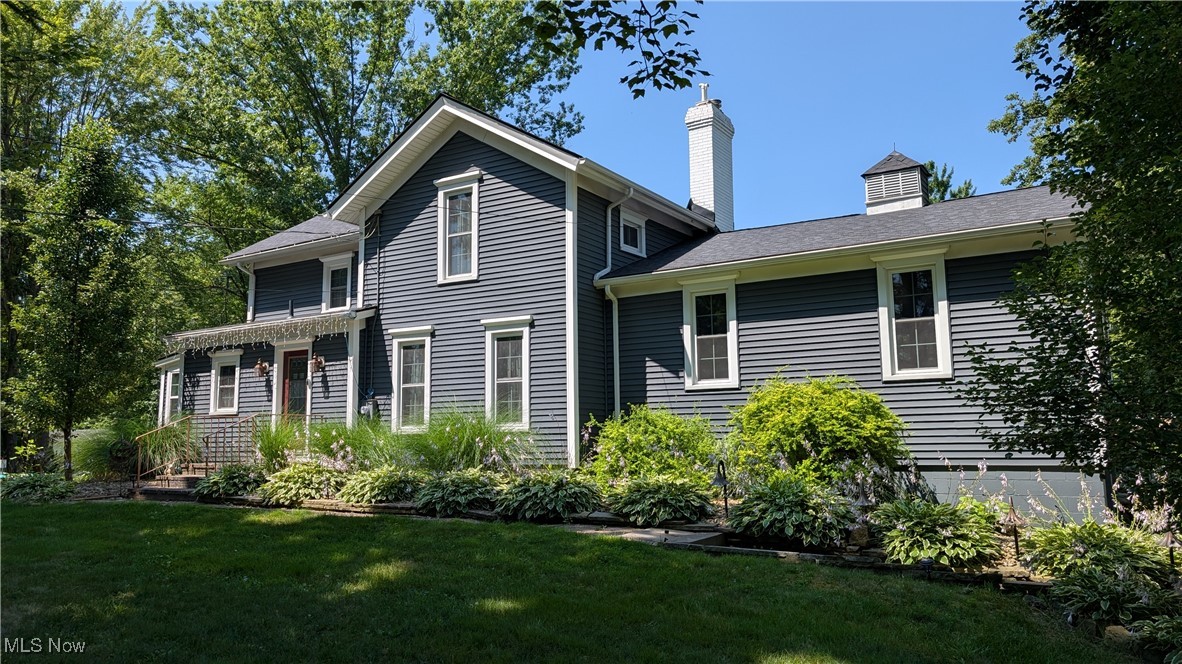 MOVE-IN CONDITION FAMILY HOME LOCATED IN A QUIET NEIGHBORHOOD IS PERFECT FOR THOSE SEEKING A PEACEFUL RETREAT. Turn-of-the-century architecture with stunning modern cosmetic and mechanical updates, this three/four-bedroom residence will take your breath away! An expansive, treelined lot explodes with color in the fall, perennial gardens bloom throughout the spring and summer. The kitchen is a delight, adjacent to the first-floor laundry, updated full bath, backyard entry with coat closet and 4-season sunroom that easily converts to a fourth bedroom. Original, refurbished wood floors fill the home with old school charm. A front foyer leads to a formal dining room which leads to an elevated living room with deluxe wood burning stove and stylish French doors opening onto a spacious deck, offering ample space for entertaining family and friends. The second level has another updated full bath with deluxe bidet and two sizable bedrooms. Excellent storage areas throughout the home! An attached garage and 40x32 outbuilding with parking area provide room for vehicles, equipment or toys. The pole barn is a
mechanic’s dream with upgraded roof, electrical and lighting. A surprise for those who love nature are the woodland trails meandering through a forest of perennial gardens, past a private campsite and into the backyard. Your family will make memories to last a lifetime, welcome home!