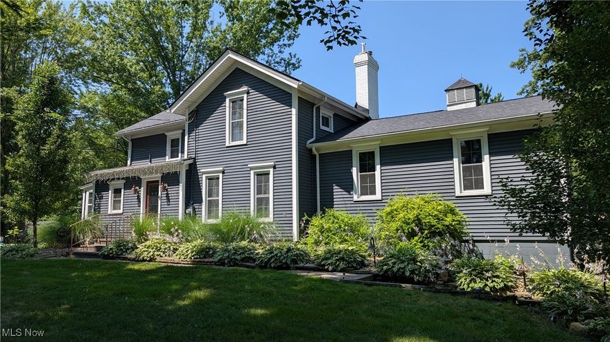 MOVE-IN CONDITION FAMILY HOME LOCATED IN A QUIET NEIGHBORHOOD IS PERFECT FOR THOSE SEEKING A PEACEFUL RETREAT. Turn-of-the-century architecture with stunning modern cosmetic and mechanical updates, this 3/4-bedroom residence will take your breath away! An expansive, treelined lot explodes with color in the fall, perennial gardens bloom throughout the spring,summer and fall. The updated kitchen is a delight, adjacent to the first-floor laundry, updated full bath, backyard entry with coat closet and 4-season sunroom that easily converts to a fourth bedroom. Original, refurbished wood floors fill the home with old school charm. The foyer leads to a formal dining room, adjacent to the first floor bedroom. Off the dining room is an elevated living room with deluxe wood burning stove and stylish French doors opening onto a spacious deck, offering ample space for entertaining family and friends. The second level has 2 large bedrooms and another updated full bath with deluxe bidet and free standing tub. An attached 2 car garage and 40x32 outbuilding with parking area provide room for vehicles, equipment or toys. The pole barn is a mechanic’s dream with new steel roof and gutters, upgraded electrical and lighting. A surprise for those who love nature are the woodland trails meandering through a forest of perennial gardens, past your private campsite and into the backyard with peach trees and berry bushes. This home will make memories to last a lifetime! Seller's motivated, all reasonable offers considered.