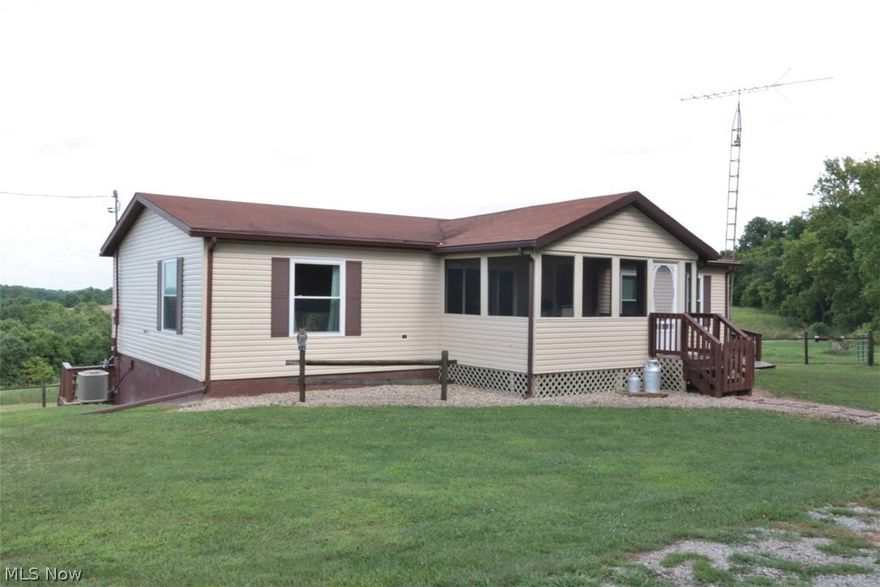 Absolutely beautiful country setting! See for miles! Convenient to The Wilds, AEP, Blue Rock State Park! Large stocked pond.  Potential to be organic farm (owners have only sprayed along the high tinsel fence lines, approx 7 - 9 acres fenced!). Currently has free gas available. Walnut, pear, sugar pear, Bartlett pear, white peach and persimmon trees! Lots of blackberry, raspberry and Japanese wine berry plants as well! Generator will stay. UV light system on well! Many additional updates including windows and siding! Newer electric service and gas line and high and low pressure regulator! Additional features include an enclosed porch, inviting living room, formal dining room with woodburning fireplace (owner currently uses electric logs), and easy to work in open kitchen! Partially finished, walk-out lower level includes additional laundry room and woodburning stove. 18 x 20 shed. This barely scratches the surface of all this property has to offer but you will be outside on the back de