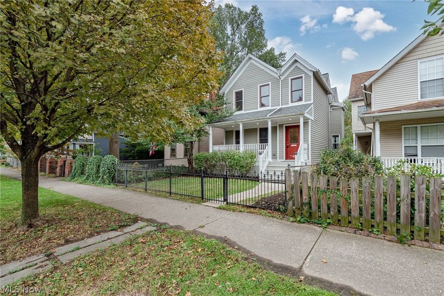 Nice! Move right in to this beautifully renovated colonial in the heart of Ohio City. This delightful home provides 2594 square feet of living space with a welcoming floorplan, spacious bedrooms, and a nice front porch and back deck! A wrought iron fence surrounds the home and opens to welcome you to the front yard and nice covered front porch. As you step inside, newer hardwood floors greet you in the foyer and flow throughout the main level. The living room is open to the kitchen and dining area, creating a cohesive atmosphere. The kitchen includes gorgeous granite counters, plenty of cabinetry, and stainless steel appliances. Plus, there is a sunny eat-in area and a large pantry! At the back of the house, you will find a spacious family room, a half bathroom, and deck access. Upstairs, there are three bedrooms, two full bathrooms, and a convenient laundry room with appliances. The owner's suite is very spacious and includes a walk-in closet and a luxurious en-suite bathroom with two