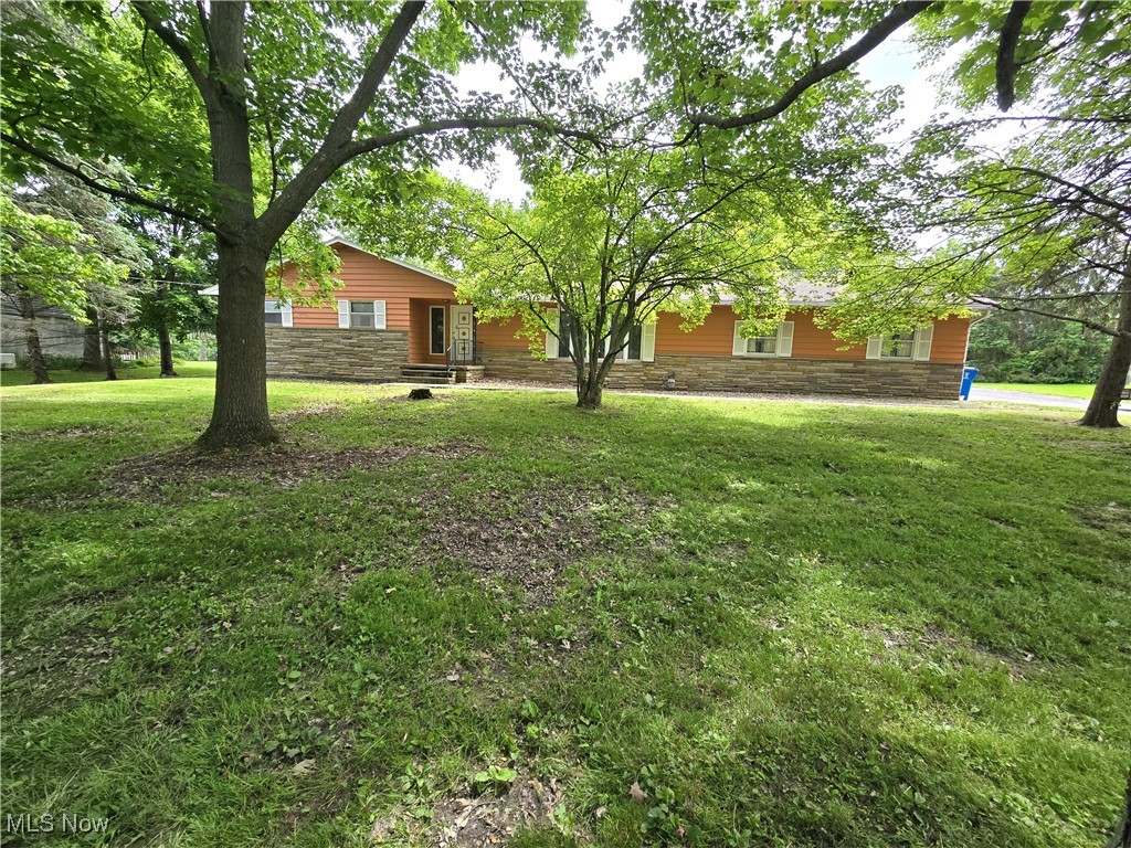Tremendous opportunity to own this large one-level home on a quiet street in Chesterland. The property sits on just over 2 acres and is near the Gates Mills border which makes it a very convenient distance from both Mayfield and Chesterland shopping and services all while providing a relaxing country experience. The house boasts a total of 5, yes FIVE, garage spaces! There is an attached 3 car garage plus a large detached 2 car garage to house all your toys. The interior has a great layout with a large living room and family, 2 full baths on the main floor (including 1 off the master) and a full basement that is partially finished. There is some updating needed but plenty of equity in the property at this price.