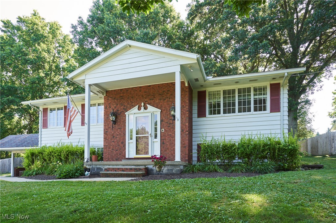 Brimfield Township bi-level with a total of 2,800 square feet of living space. This spacious & well-maintained home blends classic design with modern updates. 4 bedrooms, 2 1/2 baths. Nice size kitchen with cherry cabinets, custom island and pantry & access to backyard. Dining & living room that is open and has an inviting layout on first level as well as 3 of the bedrooms including owner’s bedroom and bath. Lower level has a spacious family room with a fireplace and access to the patio & backyard that is perfect for entertaining. Lower level also includes the 4th bedroom, 1/2 bath and access to the garage. Located on a private road in the Field Local School District and access to the Mogadore Reservoir and trails. Updates include gutter guards with transferable warranty, slider in basement, water heater, carpet in family room & updated hall bath and master bath. Home warranty included! Seller has a 3.25% FHA transferable loan than can be transferred to buyer.