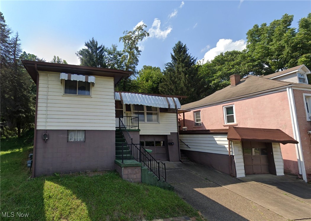 Sharp 3 Bed 2 Bath home with a 2 car attached and detached garage under a walkout sundeck located on 2 nice commercial lots. Nice hardwood floors with newer mechanicals and appliances.