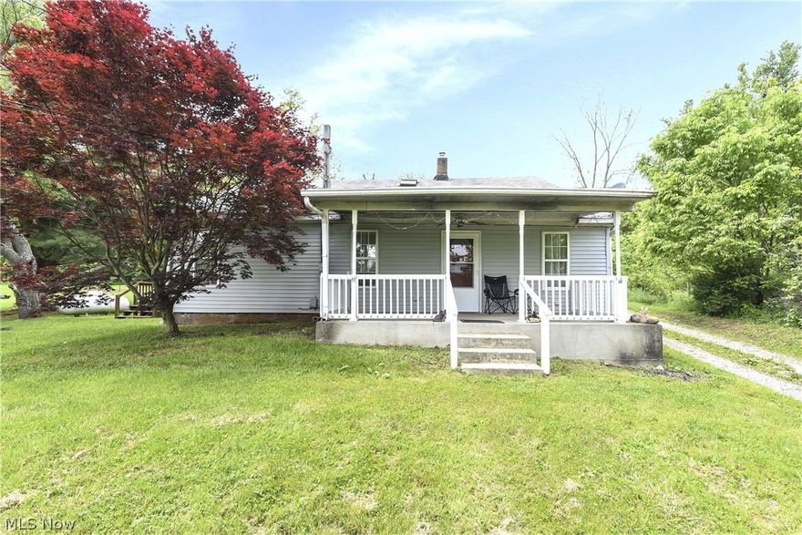 Spacious Farmhouse Nestled on 2 Acre Lot. Cozy Front Sitting Porch Welcomes You to this Home! The Huge Living Room Provides Ample Room to Spread Out and Entertain! The Huge Eat-In Kitchen Features Oak Cabinets, Linoleum Floors and Comes Fully Applianced. Immediately off the Kitchen is a Large Deck for Outdoor Living! The Main Floor Also has a Nice Size Bedroom and a Huge Full Bath. Upstairs is Another Full Bath, the Master Bedroom and 2 Additional Bedrooms. New Carpet in Bedrooms! Gorgeous Hardwoods in Living Room! Vinyl Siding & Vinyl Windows for Low Maintenance  Exterior! Great Value for Location!