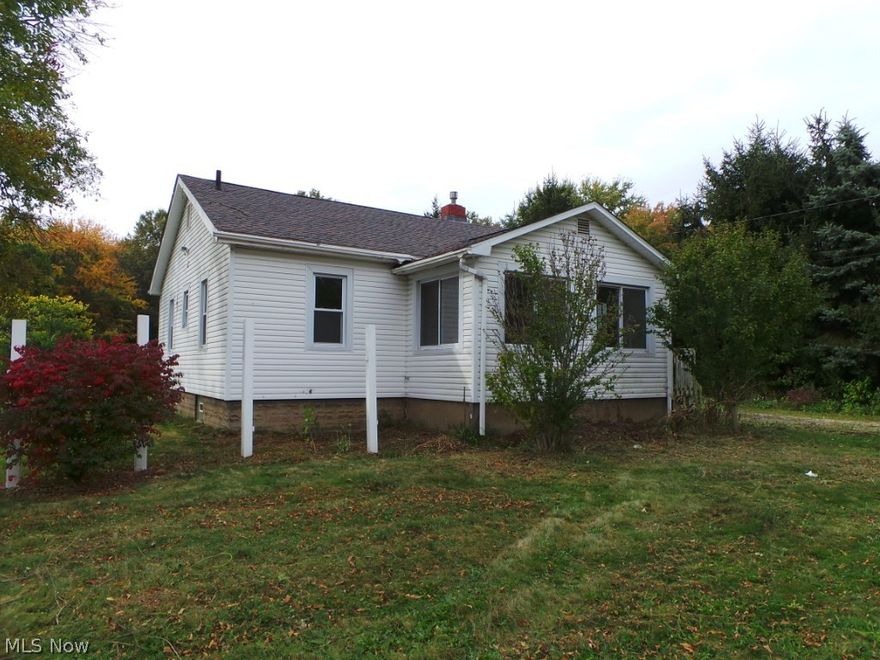 Two bedroom bungalow on large country lot.  Huge garage!  Pretty wood floors & great eat in kitchen.  Property is sold AS IS.  Equal Housing Opportunity. FHA uninsurable.