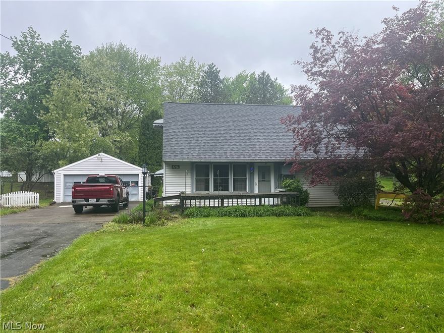 Remodeled kitchen, double garage, wooded backyard. 50 x 275 extra lot included.