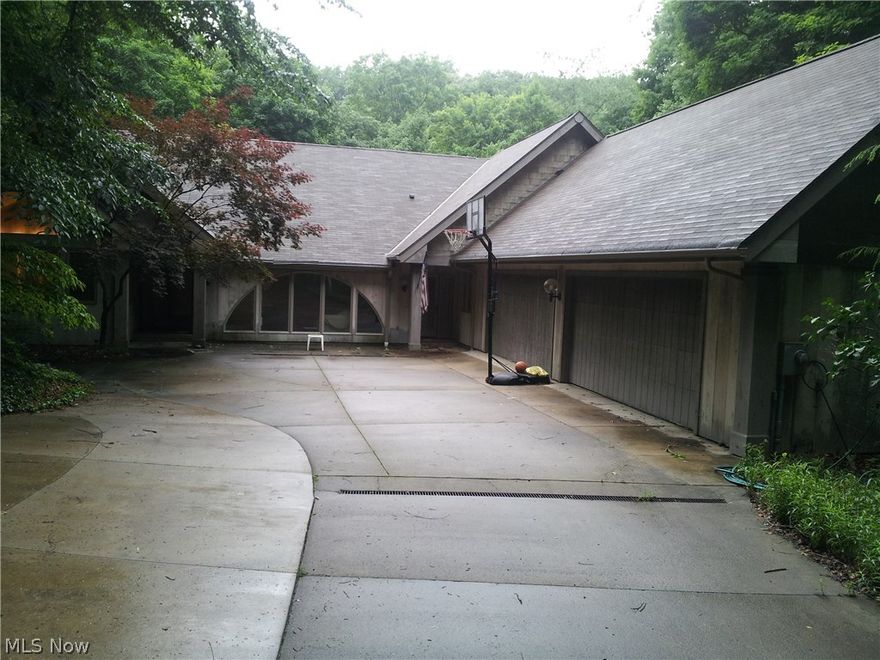 A retreat in town? You can't see it from the street as it is nestled in the woods. Your very own getaway without leaving town. Beautiful ranch home with three bedrooms and three baths along with a fabulous 38 x 27 Pool Room with a 24 x 14 inground heated pool and hot tub. Top that off with a 4-car garage and decks that run from top to bottom facing a very scenic wooded area with wildlife.