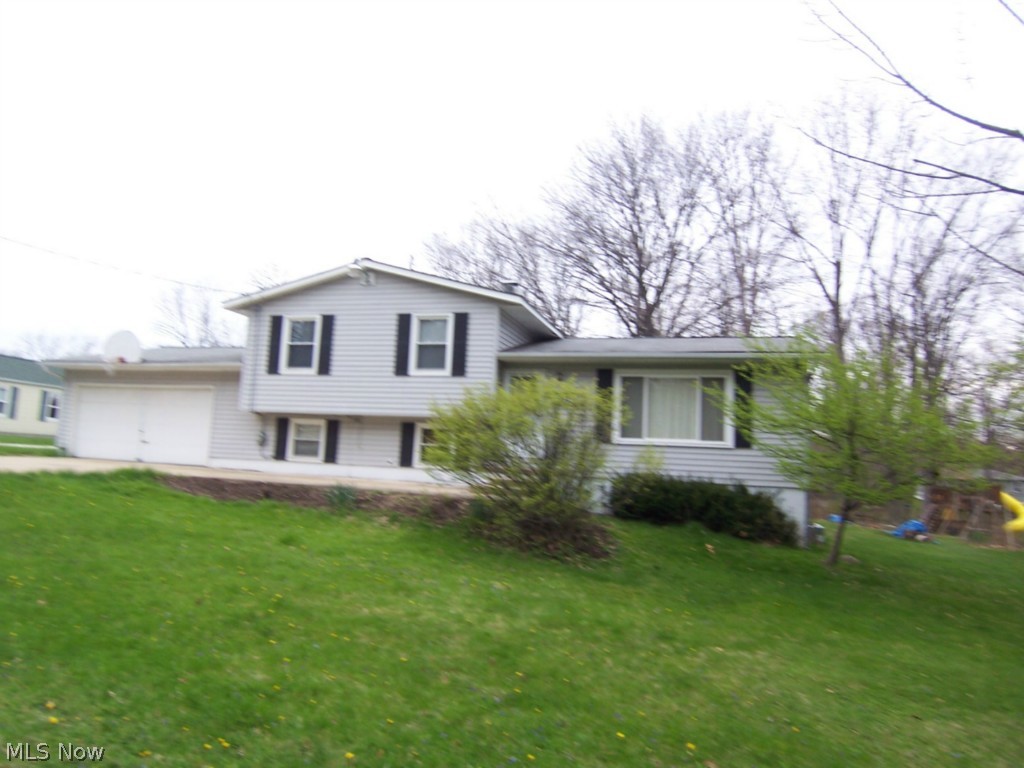 Come home to this spacious split level sitting on approx. half acre level lot. Large living area, formal dining, eat in kitchen with appliances.
Beautiful family room with wood burning stove. First level office, two full baths. Basement for storage and offering a second Den or Study room.
Screen rear porch overlooking yard, Two car attached garage. Updated windows, furnace and water tank.