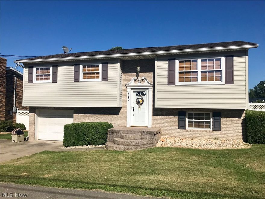 Pretty as a picture! This 3 BR, 2 BA split entry features neutral colors and lots of updates--including a new bathroom with ceramic surround shower on lower level. The huge sun room leads out to a 2-tiered deck above the large, fenced back yard. There is a separate lot behind the house with a 23X30 garage on it that can be sold separately if the buyer desires for $29,500.