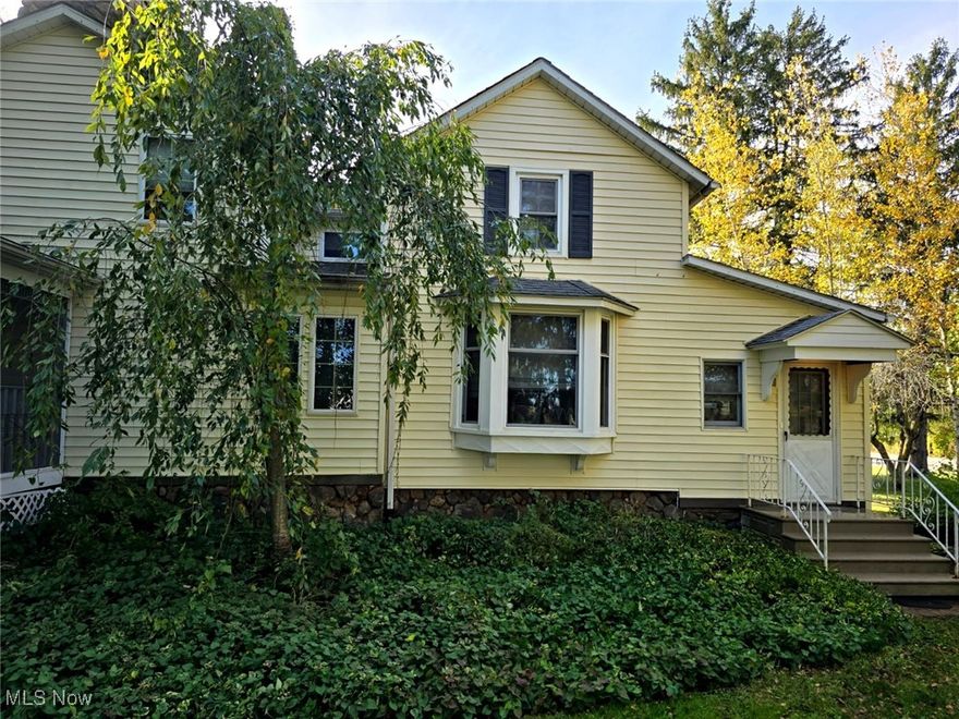 Here is your chance to own a classic and charming Colonial with Modern Architectural Updates that lends timeless curb appeal to this historic Medina home. Positioned on a 1-acre farm-like setting, this property offers the best of both worlds-peaceful country character with city convenience. A relaxed rural lifestyle without being far from anything. Unwind on the covered wrap around porch and enjoy views of the mature trees and listen to the sounds of the waterfall pond. Follow the path past the pond to the 30'x25' barn with a loft, formerly a one stall horse barn.
Inside, a spacious great room with cathedral ceilings, beams, skylights and a two story stone fireplace serves as the heart of the home. The service bar is great for entertaining and has a pass through to the kitchen. From the Great room is the dining room with wood parquet flooring, eat-in kitchen with island breakfast bar, laundry room and 1/2 bath. From the dining room, step down into the 4 season room w/skylights which also leads to the front entrance of the home.
Heading upstairs you will find a large primary bedroom, (formerly 2 bedrooms), the second bedroom w/skylight, full bathroom w/skylight and an impressive loft with built in cabinets and window seating open to the great room below. This space can easily serve as an additional large bedroom/bathroom or flexible living area.
Conveniently located near I-71, I-76, OH-18, Medina's Victorian Public Square, rec center, shopping, restaurants, parks, golf courses, and many other local attractions.
Great room addition built and windows replaced approx 2000, Tie into Public Sewer in 2024. A 1-year APH Home Warranty is included.
Youtube link: https://youtu.be/VxX00lANqBk?feature=shared