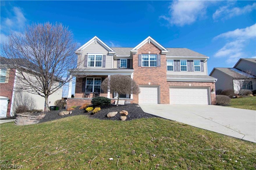 Springhill Phase Two offering a four bedroom, 3.5 bathroom colonial style home with a three car attached garage...all that you are looking for and more!  993 Dalby Circle, Uniontown in the Green Local School District.  3,240 square feet of spacious rooms.  Greet your guests in a welcoming foyer with hardwood flooring which leads to a beautiful two-story great room with a fireplace accented by pillars and double-tiered windows, opening to the large kitchen with plenty of storage, a breakfast bar and dinette area.  Enjoy the sculpted stamped concrete patio as you entertain in all of this connected indoor/outdoor space surrounded by a privacy fence installed in 2018.  The furnishings are up to date in this young 2010 home, including the formal dining room, first floor laundry room and office.  Ascend the staircase leading to a second story loft area perfect for enjoying the open vibe of the great room before reaching the private owners' suite.  This peaceful oasis boasts vaulted ceilings,