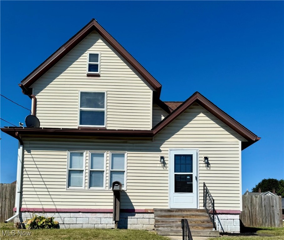 Absolutely stunning colonial home with completely renovated from top to bottom interior. 1,466 sq. ft. includes breezeway entry showcasing brand new windows to let lots of light gleam in! Living room includes new flooring. new windows and chic light fixtures/fans. Oversized kitchen w, laundry, formal dining area (once used as main floor bedroom) and full bathroom on main level. The second floor has three ample sized bedrooms & full bath with cute mirror and vanity. Easy walk-up attic/storage, full, divided basement, gas furnace. Backyard is fully fenced with concrete parking that leads to alley access, utility barn/Converted from garage (May be able to convert back). 51' x 130' larger sized lot. Closest thing you will get to a new build in this fantastic price point! Close to schools and shopping.