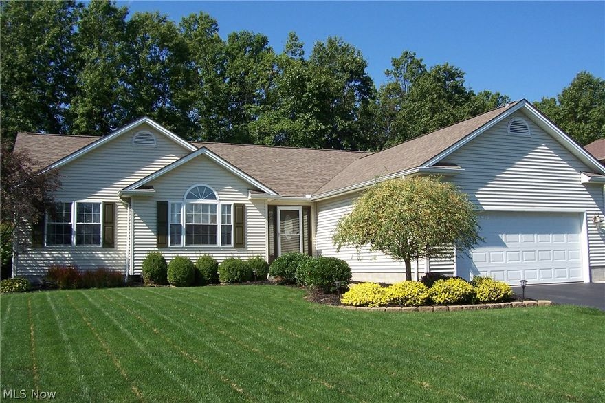 Move right in this newer ranch featuring private, wooded backyard and fantastic open floor plan with vaulted beam ceilings and storage throughout! 
Built in 2006 in great cul-de-sac location in Mulberry Run this home has it all including finished theater room setup, office area and fourth bedroom with window and closet in basement. Great room is spacious featuring laminate flooring and is open to dinette/kitchen area with pantry and peninsula.  Brushed nickel fixtures throughout! Sliding doors lead to covered porch with multi tiered deck (upper at 15 x 14, lower at 19 x 30), 16 x 15 paver patio and firepit.  Enjoy family gatherings and outdoor entertaining while taking in the scenic, wooded view.  First floor laundry is conveniently located in hall to bedrooms. Master suite boasts double closets, vaulted ceiling with ceiling fan, and bath with garden tub, ceramic tile, and gorgeous tiled shower with glass doors.  Other bedrooms are sunny and bright.  Large finished theater room keeps