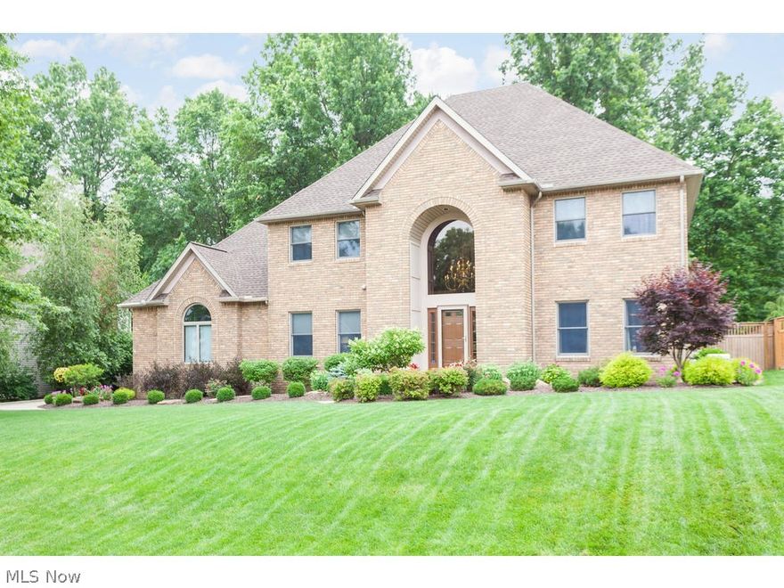 FABULOUS, STATELY Brick Colonial in Cobblestones of Copley. A grand, 2-story foyer w/curved staircase greets you as you enter, flanked by a large Office to your left and Formal Living Room to your right. Beautiful crown molding & hardwood floors, tasteful decor throughout. Well-appointed kitchen w/large eat-in area, granite counters, granite center island, ceramic back-splash, and large walk-in pantry. 1st floor laundry. Off of the kitchen is a large sunken Great Room with tall, vaulted ceilings, large windows, gas fireplace and built-ins. Sliders lead to a 2-tiered deck.  Large formal Dining Room. Through the double doors upstairs is a spacious Master Suite with massive walk in closet - 14x17! - and dressing room, attached to the Master Bath with jetted tub and tiled shower along with double bowl sinks. Finished lower level w/1,400 more finished square footage and a 1/2 Bath. Whole house generator (2016) and new roof (2016). 
Storage shed, gorgeous new fencing around the spacious yar