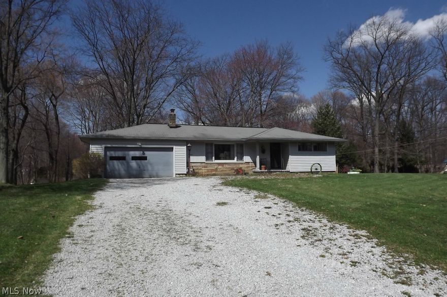 A little love will go a LOOOOONG way in this cute little ranch style home. Already in a country setting, in an area of well tended homes, on over a half acre lot, this home has tremendous potential as a wonderful starter home (with a little work) or an investment property. The structure was solidly built mid-century with the tell tale quality and characteristics so indicative of the 1950's, such as wonderful built-ins and unique style. The home features 3 bedrooms, dinette and living room, all with original hardwood flooring. The kitchen has a newer refrigerator, built in oven and counter top range, plus a charming angled breakfast bar. The lower level has a family room with built-in glazed brick bar and storage benches, as well as a glazed tile shower and commode. The furnace and A/C were replaced in 1992 with humidifier and electronic air filter, plus a water softener and water filtration system. The exterior features include an enormous corner lot, large shed, outdoor fireplace with