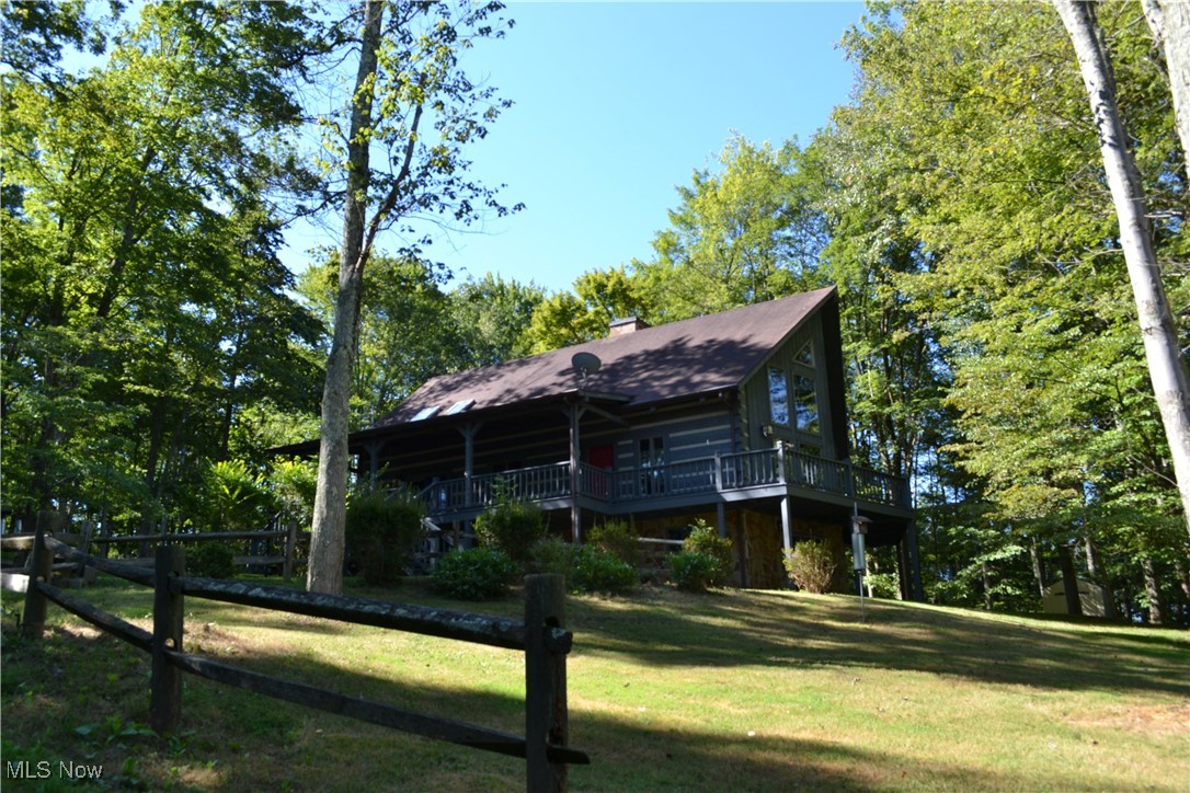 New Price! Charming 2-bedroom 2-bath log home on 3.95 Private Acres! Step inside to a warm, inviting living space featuring a stunning stone fireplace and breathtaking floor-to-ceiling windows. Enjoy country living while just minutes away from local amenities. Whether you're sipping coffee on the front porch or watching wildlife this home is the perfect country retreat. Book a showing today to see this beautiful little hidden gem!